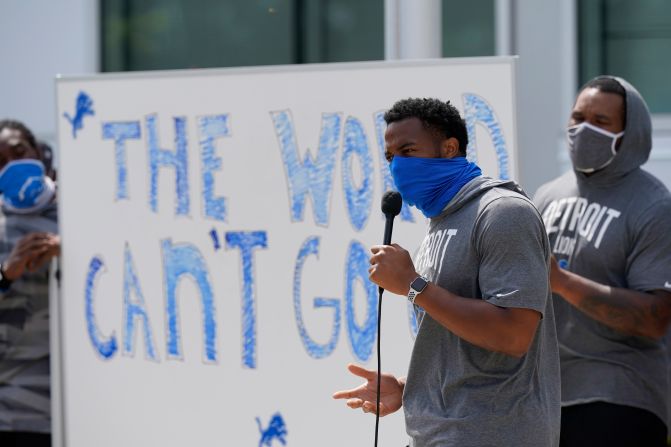 Detroit Lions defensive end Trey Flowers addresses the media with his teammates outside their practice facility on August 25. The Lions canceled their practice in light of the Blake shooting, and they discussed the incident in a team meeting that lasted hours. "We're going to spread our message; we're going to do it as a team," Flowers said. "We understand that somebody's going to try to skew the narrative ... get the message lost, but we're going to stay focused on the topic."