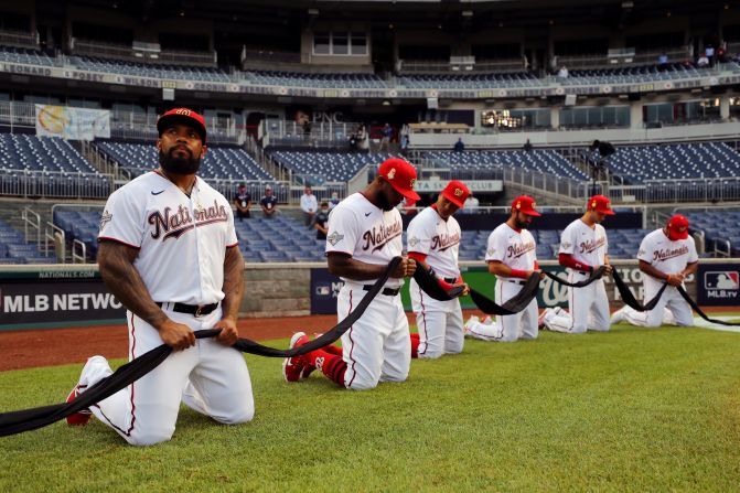 The Washington Nationals observe a moment of silence before <a href="index-1027.html" target="_blank">Major League Baseball's opening game</a> on July 23. Their opponents, The New York Yankees, also took a knee, and the initials BLM were on the pitcher's mound for the game.