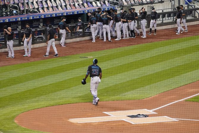 Miami Marlins outfielder Lewis Brinson walks off the field August 27 after placing a Black Lives Matter T-shirt on home plate in New York. The Marlins and New York Mets walked off the field after a moment of silence, choosing not to play their scheduled baseball game.