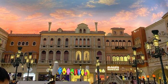 An exterior photo of a las vegas building courtyard at isc west 2024 against a beautiful sunset in the background