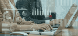 image of two people with hands on laptop keyboards with graphics of risk assessment data overlaid to represent Farm Credit Canada's winning case study with Resolver on its enterprise GRC program