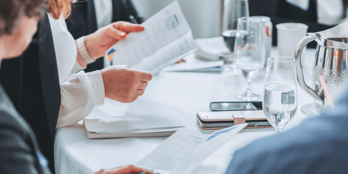 Key insights from resolver's grc day 2024 6 Participants at resolver's grc day 2024 engaging in a group discussion on prioritizing grc software enhancements with photo focus on a hand holding a ux assignment paper.