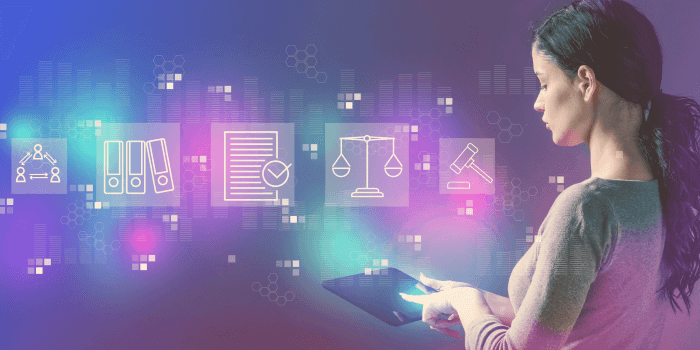 Woman with long hair tied in ponytail holding tablet with digital icons floating above representing compliance management software benefits